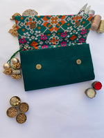 Load image into Gallery viewer, Bottle Green Navratna Patola X Solid Silk Encase Clutch - IBHI